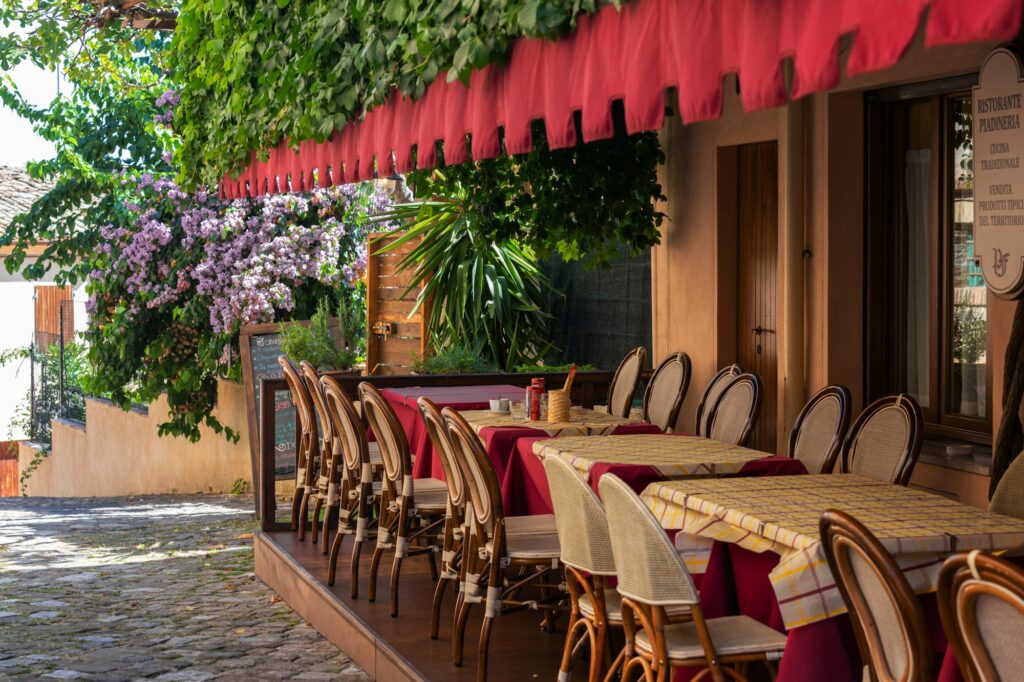 Charming outdoor cafe with ivy-covered awning