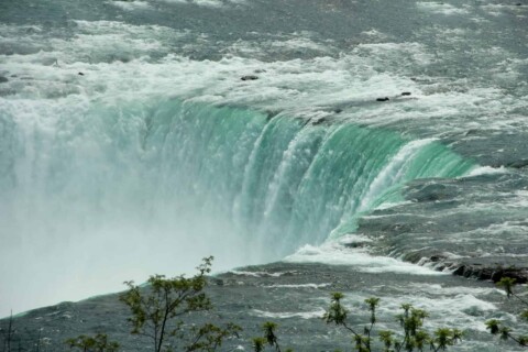 Side View of the Magnificent Niagara Falls in the Canadian Side called Horseshoe Falls.
