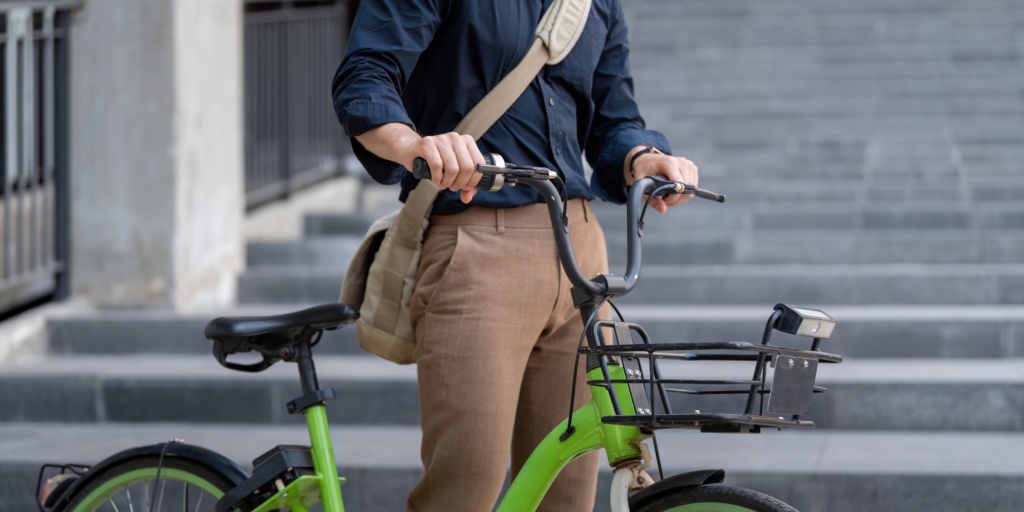 Businessman Commuting on Bicycle for Eco Friendly Transportation, Sustainable Urban Lifestyle, and